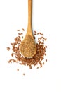 Flax seeds. Flaxseed powder in a wooden spoon. Standing on a white background Royalty Free Stock Photo