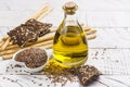 Flax seeds oil and raw flax seeds Royalty Free Stock Photo