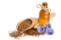 Flax seeds in wooden scoop, bottle with oil and beauty flowers Royalty Free Stock Photo