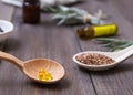 Flaxseed oil in caps on a wooden background. Phytotherapy. Royalty Free Stock Photo