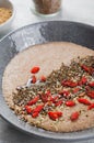 Flaxseed Porridge in a Bowl, Healthy Breakfast or Snack, Porridge Decorated with Chia Seeds and Goji Berries