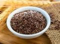 Flaxseeds in white bowl