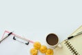 Flay lay space on the desk Area space enter text. mockup coffee cups, Pen note paper Placed on a White table wood