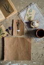 Flay lay, top view of the herbarium, dried lavender flowers, notebook, book for notes, pen and spring summer pictures on a concret Royalty Free Stock Photo