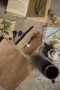 Flay lay, top view of the herbarium, dried lavender flowers, notebook, book for notes, pen and spring summer pictures on a concret