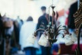 Flea market: Old fashioned lamp in the foreground, people in the blurry background