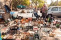 Flea market sellers trading with vintage stuff, rare souvenirs, toys and retro goods