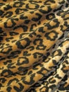 Fleecy brown draped leopard skin fabric Royalty Free Stock Photo