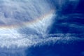 Fleecy clouds and rainbow Royalty Free Stock Photo