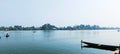 Fleet of boats sailing together across a vast expanse of a lake