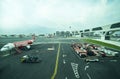 A fleet of commercial aircrafts being serviced at the terminal of KLIA2 international airport Malaysia. Royalty Free Stock Photo