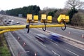 Fleet, Hampshire, UK - March 11th 2017: Average speed cameras in operation on the M3 Motorway with intentional motion blur on vehi