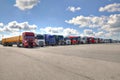 Fleet of lorries with trailer in courtyard of logistics terminal Royalty Free Stock Photo