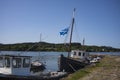 Old, wooden fishing vessels anchored along a pier in the Isle of Skye, Scotland, United Kingdom