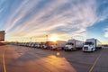 Fleet of trucks parked at parking lot yard of delivery company. Truck transport. Logistic industry. Freight transportation. Royalty Free Stock Photo