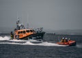 Fleetwood RNLI sailing in sea with their D-class and all-weather lifeboats