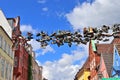 Shoes hanging between old houses in the german northernmost town called Flensburg