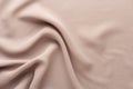 Flesh colored fabric draped with large folds, textile background