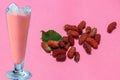 flesh of ripe mulberries and mulberry water with pink background, selective focus on subject, mulberry juice and iced