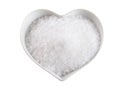Fleur de sel in a heart-shaped bowl on white Royalty Free Stock Photo