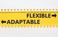 Flexible or adaptable symbol. Concept word Flexible Adaptable on beautiful yellow paper. Beautiful white paper background.