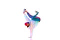 Flexible, artistic young man, hip hop, breakdancer in motion, performing isolated over white studio background in neon