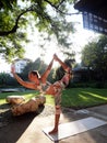 Flexible caucasian girl practice lord of the dance yoga pose in park at sunshine