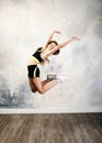 Flexible cute little girl child gymnast jumping and having fun Royalty Free Stock Photo