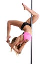 Flexible female dancer balancing on pole Royalty Free Stock Photo