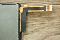 flexible flat cable of mobile phone for connect circuit board to device screen on table Royalty Free Stock Photo