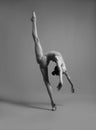 Flexible girl in a gray swimsuit