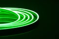 Flexible green LED neon strip on black background Royalty Free Stock Photo