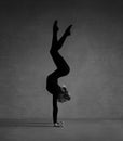 Flexible gymnast posing in black clothes Royalty Free Stock Photo