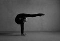 Flexible gymnast posing in black clothes Royalty Free Stock Photo