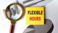 FLEXIBLE HOURS text on sticky on chart, business