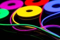 Flexible led tape neon flex in different colors on black background Royalty Free Stock Photo