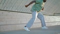 Flexible man legs dancing stairs closeup. Unknown guy practicing freestyle