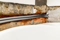 flexible plumbing pipe are routed in chiseled wall Royalty Free Stock Photo