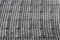 Flexible shingles of red-brown color on the house roof. Royalty Free Stock Photo