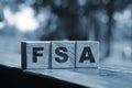 Flexible spending account FSA written on a wooden cubes. Financial concept Royalty Free Stock Photo