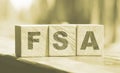 Flexible spending account FSA written on a wooden cubes. Financial concept Royalty Free Stock Photo