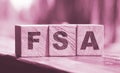 Flexible spending account FSA written on a wooden cubes. Financial concept Royalty Free Stock Photo