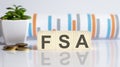 Flexible spending account FSA written on a wooden cubes Royalty Free Stock Photo