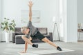 flexible sporty man exercising on yoga mat Royalty Free Stock Photo