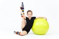 Flexible teen girl doing gymnastics exercises on fitness ball Royalty Free Stock Photo