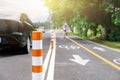 Flexible traffic bollard for bike lane.