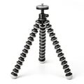 Flexible tripod with bendable legs Royalty Free Stock Photo