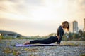 Flexible woman bends, stretching body during yoga Royalty Free Stock Photo