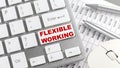 FLEXIBLE WORKING text on a keyboard wirh chart and pencil