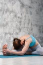 Flexible young woman doing yoga indoors Royalty Free Stock Photo